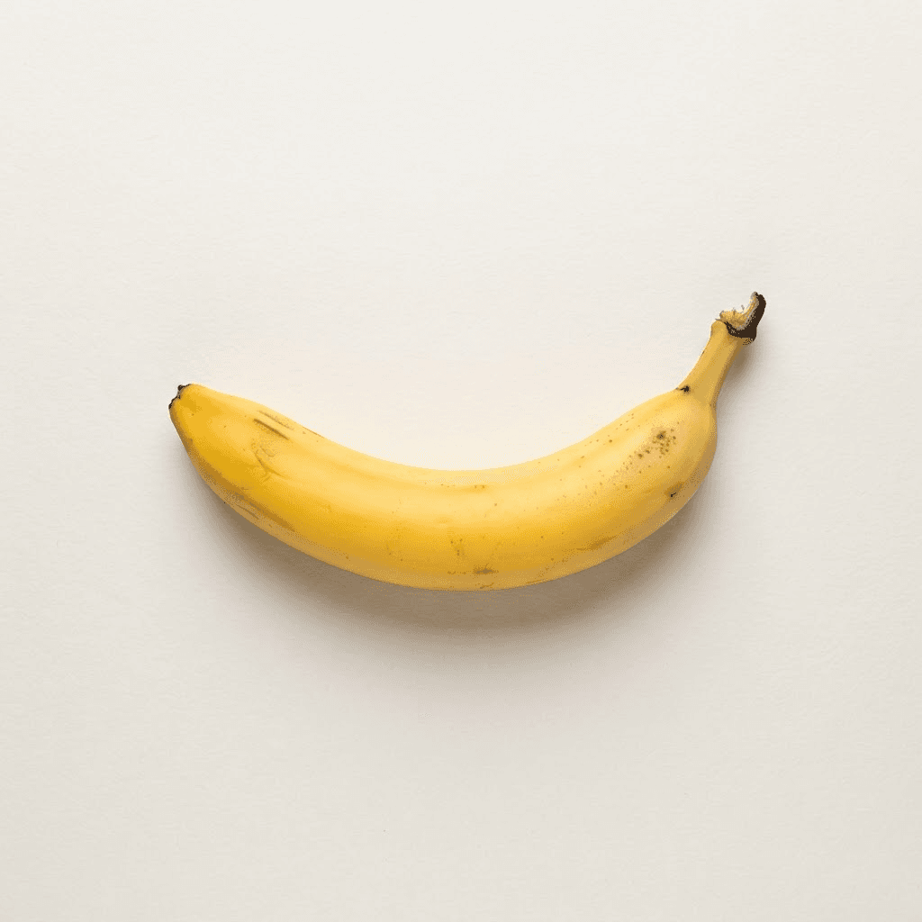 A single ripe banana on an off-white background, the SendBaNaNas product
